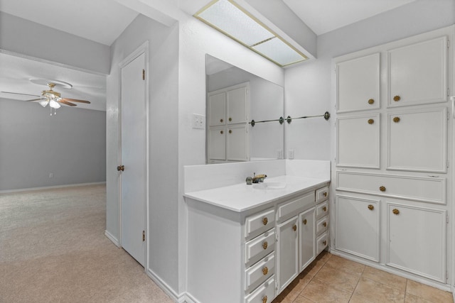 bathroom with a ceiling fan and vanity