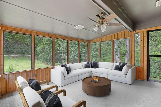 sunroom featuring an outdoor living space, ceiling fan, and visible vents