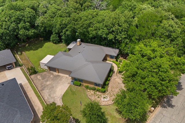 birds eye view of property with a forest view