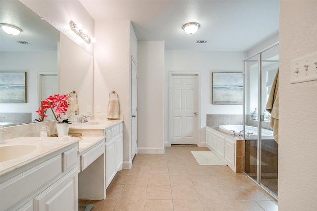 9820 Mullins Crossing Dr, Fort Worth, TX 76126 - bathroom with double vanity, a garden tub, tile patterned floors, a stall shower, and baseboards