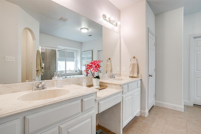 9820 Mullins Crossing Dr, Fort Worth, TX 76126 - bathroom featuring double vanity, a shower stall, tile patterned floors, and baseboards