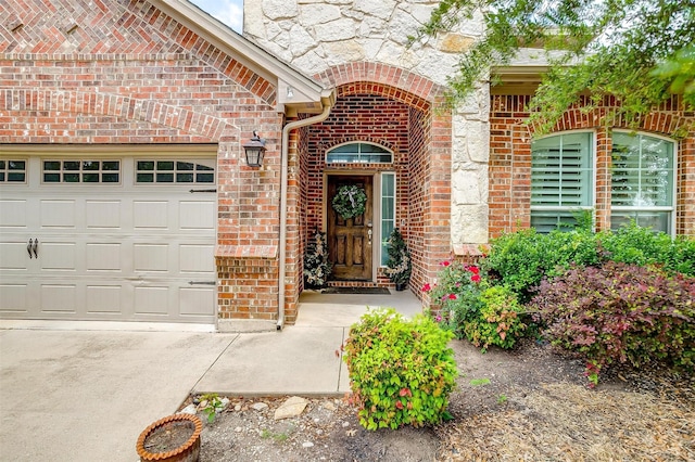 9820 Mullins Crossing Dr, Fort Worth, TX 76126 - view of exterior entry with brick siding, a garage, and stone siding