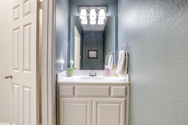 9820 Mullins Crossing Dr, Fort Worth, TX 76126 - bathroom featuring a textured wall and vanity