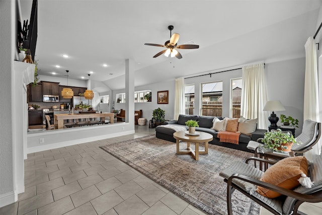 living area featuring recessed lighting, a ceiling fan, and light tile patterned floors
