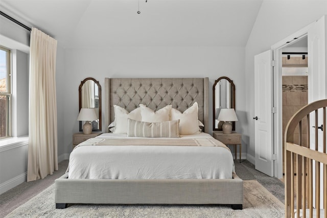 bedroom with carpet floors, baseboards, and lofted ceiling