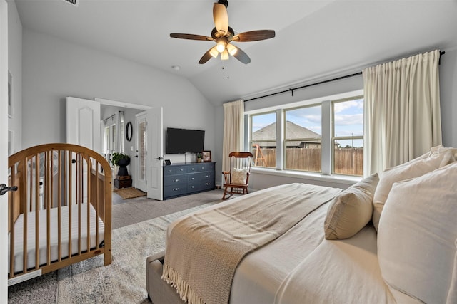 carpeted bedroom with ceiling fan and lofted ceiling