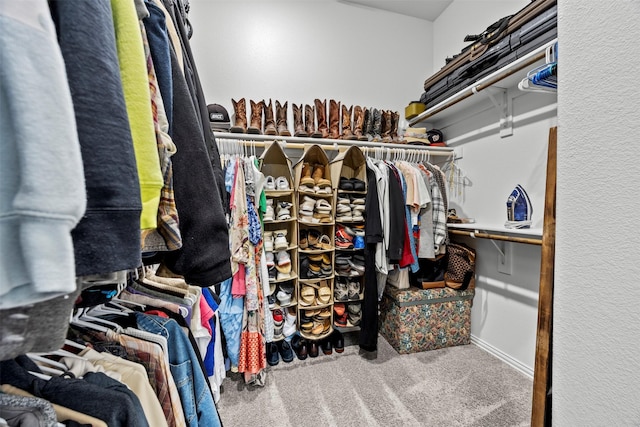 walk in closet featuring carpet floors