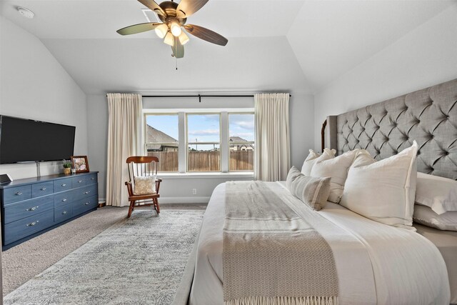 carpeted bedroom featuring a ceiling fan and lofted ceiling