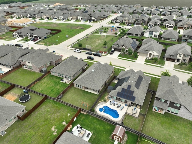 birds eye view of property with a residential view