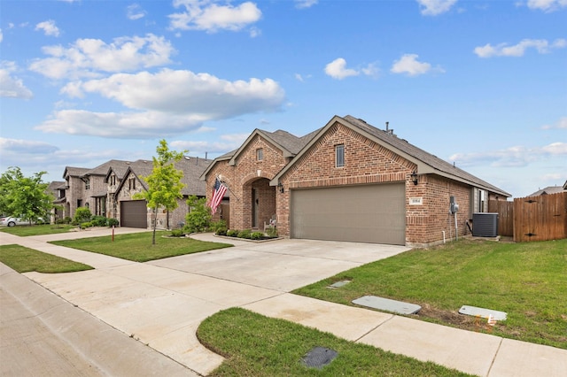 view of front of home featuring fence, brick siding, a garage, central air condition unit, and driveway