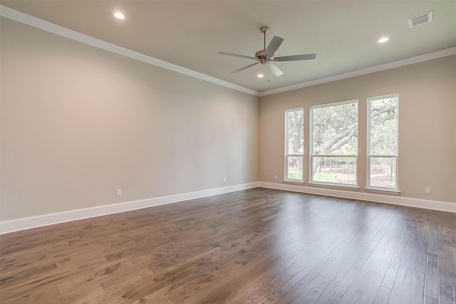 spare room featuring a ceiling fan, baseboards, dark wood finished floors, and visible vents