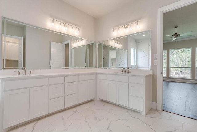 full bathroom with a sink, a ceiling fan, double vanity, and marble finish floor