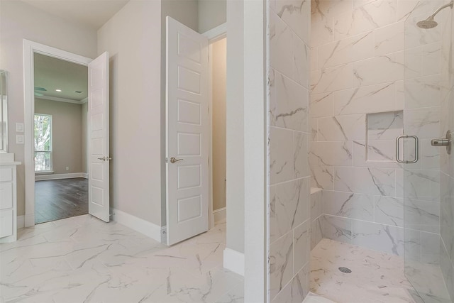 bathroom with vanity, baseboards, marble finish floor, and a stall shower