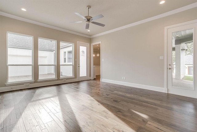 unfurnished room featuring crown molding, a ceiling fan, baseboards, recessed lighting, and wood finished floors