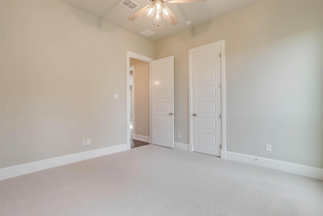 unfurnished bedroom featuring visible vents, carpet, ceiling fan, and baseboards
