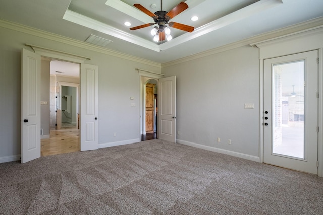 unfurnished bedroom with visible vents, a raised ceiling, ornamental molding, carpet, and recessed lighting