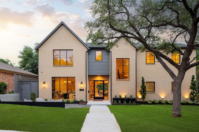 6439 Malcolm Dr, Dallas, TX 75214 - view of front of house with brick siding and a yard