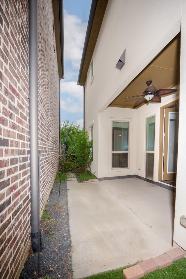view of patio featuring a ceiling fan