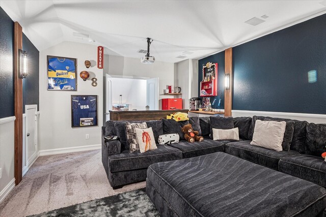 carpeted bedroom featuring baseboards and vaulted ceiling