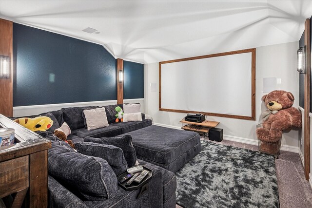 home theater with baseboards, carpet, vaulted ceiling, and visible vents