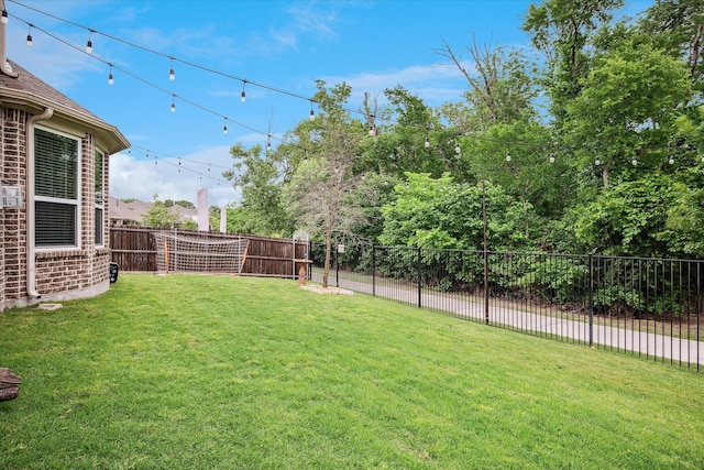 view of yard with a fenced backyard