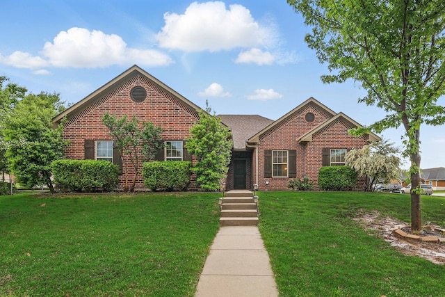 311 Wilson St, Whitesboro, TX 76273 - ranch-style home featuring brick siding and a front yard
