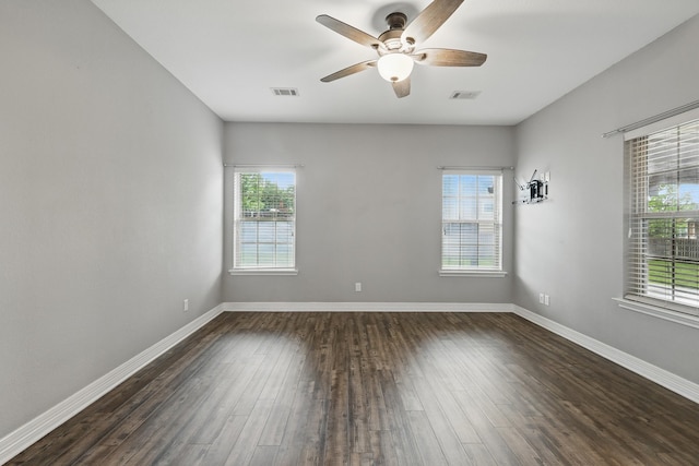 311 Wilson St, Whitesboro, TX 76273 - empty room featuring baseboards, a ceiling fan, visible vents, and dark wood-type flooring