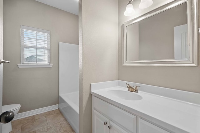 311 Wilson St, Whitesboro, TX 76273 - bathroom featuring toilet, vanity, and baseboards