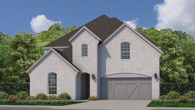 french country style house featuring concrete driveway, brick siding, and a garage