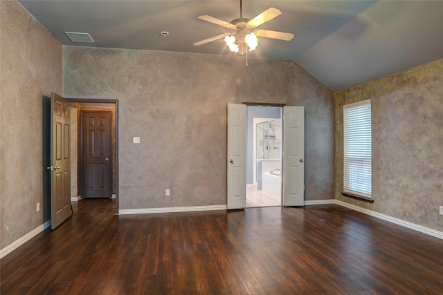 unfurnished bedroom with ceiling fan, visible vents, vaulted ceiling, wood finished floors, and baseboards