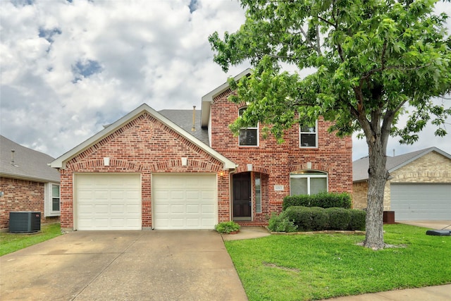 traditional-style house with an attached garage, driveway, a front lawn, and brick siding