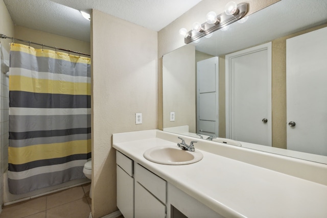 bathroom featuring vanity, toilet, tile patterned floors, a textured ceiling, and a shower with shower curtain
