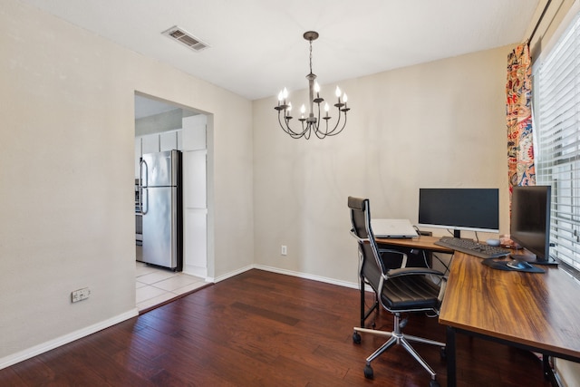 office with wood finished floors, baseboards, a chandelier, and visible vents