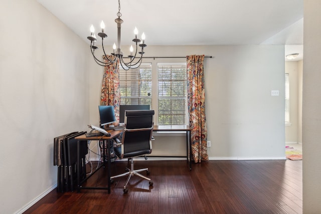 office space featuring baseboards, wood finished floors, and a notable chandelier