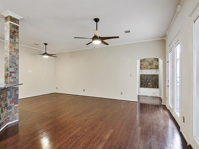 unfurnished living room featuring ceiling fan, dark wood finished floors, and a wealth of natural light