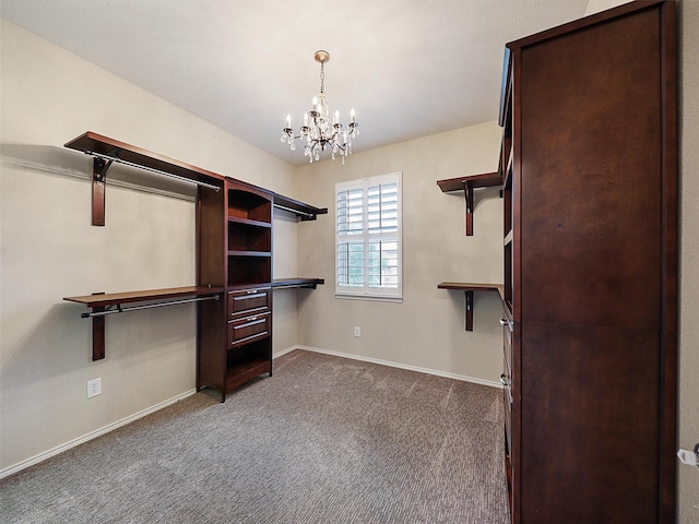spacious closet featuring carpet and a chandelier