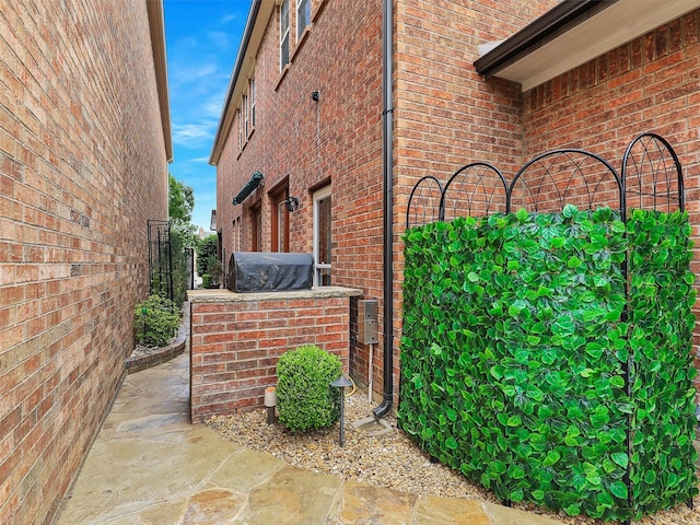 view of home's exterior featuring brick siding