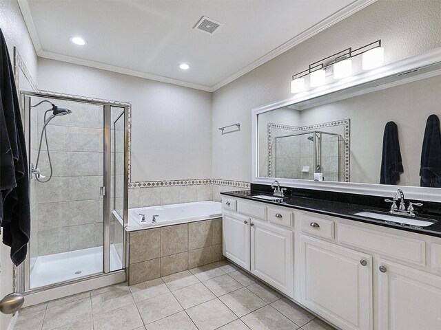 bathroom featuring a bath, tile patterned flooring, a stall shower, a sink, and ornamental molding