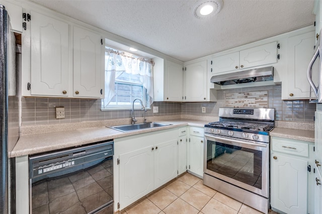 1515 Senter Rd, Irving, TX 75060 - kitchen with a textured ceiling, stainless steel range with gas stovetop, a sink, under cabinet range hood, and black dishwasher