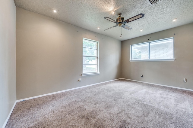 1515 Senter Rd, Irving, TX 75060 - carpeted empty room featuring visible vents, a textured ceiling, ceiling fan, and a wealth of natural light