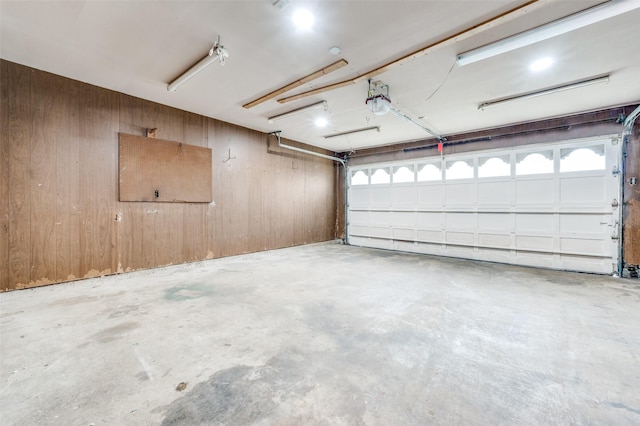 1515 Senter Rd, Irving, TX 75060 - garage featuring wooden walls and a garage door opener