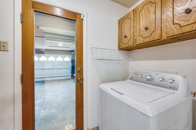 1515 Senter Rd, Irving, TX 75060 - washroom featuring cabinet space and washer / dryer