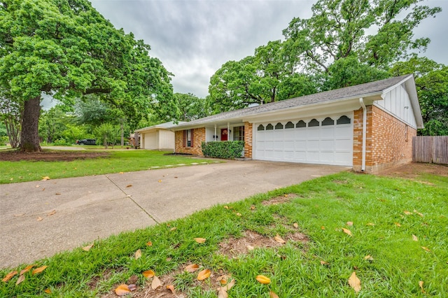 1515 Senter Rd, Irving, TX 75060 - single story home with a garage, fence, a front yard, brick siding, and board and batten siding