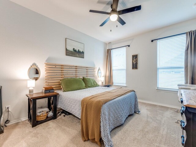bedroom featuring carpet flooring, baseboards, and ceiling fan