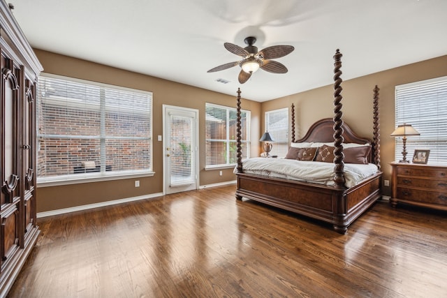 bedroom with visible vents, access to exterior, baseboards, ceiling fan, and dark wood-type flooring