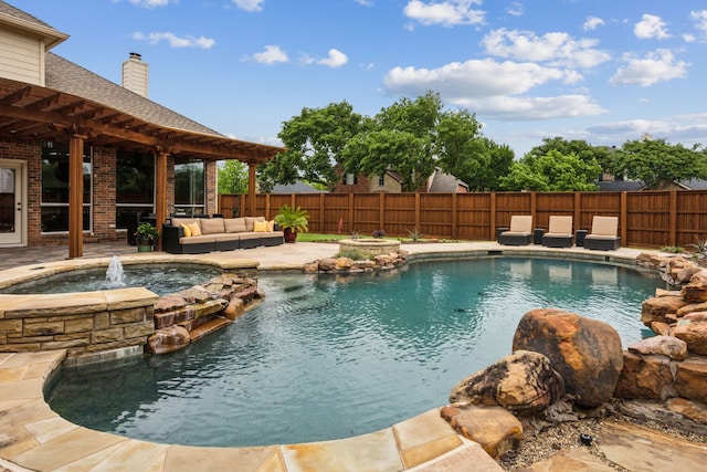 view of pool featuring an in ground hot tub, a fenced in pool, a fenced backyard, and an outdoor hangout area