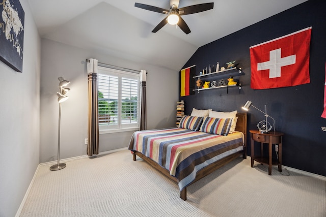 bedroom featuring vaulted ceiling, baseboards, and carpet flooring