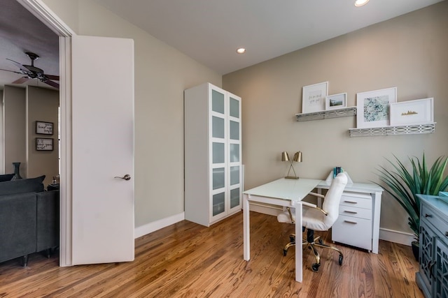 office featuring baseboards, ceiling fan, recessed lighting, and light wood-style flooring
