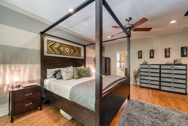 bedroom featuring recessed lighting, connected bathroom, ceiling fan, and wood finished floors