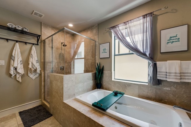full bath featuring visible vents, a garden tub, tile patterned flooring, baseboards, and a shower stall